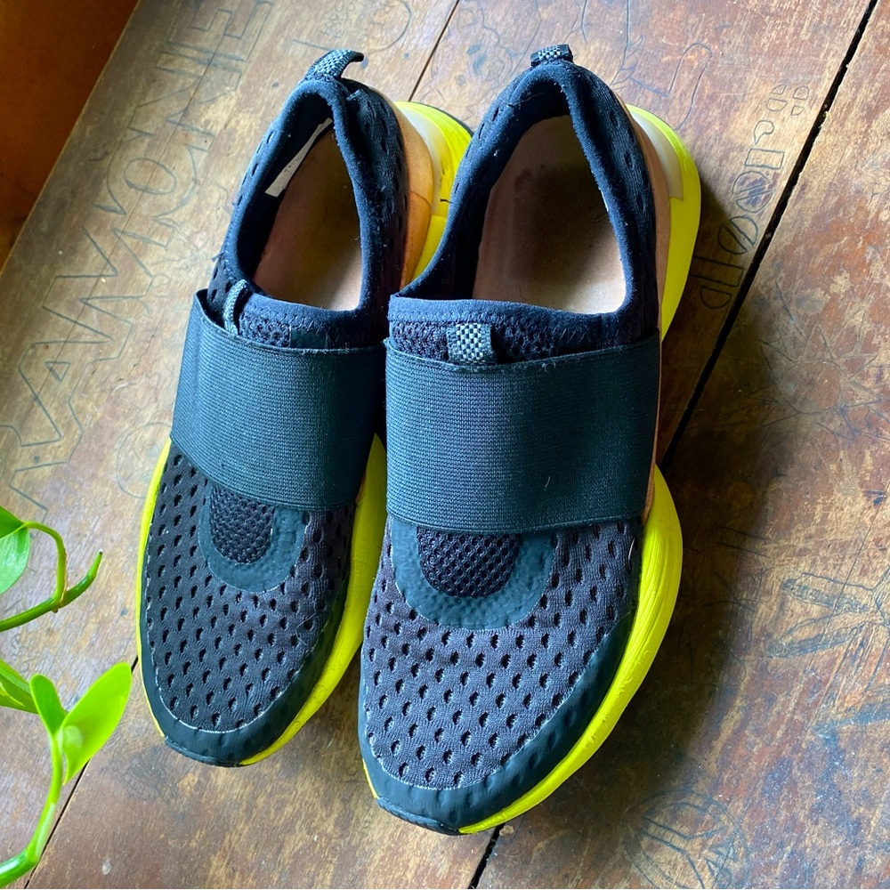 Sorel Women's Black Slip-On Athletic Sneakers with Neon Yellow Soles